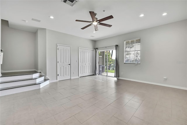 1402 Harbour Walk Rd, Tampa, FL 33602 - unfurnished room featuring ceiling fan, recessed lighting, baseboards, stairs, and tile patterned floors