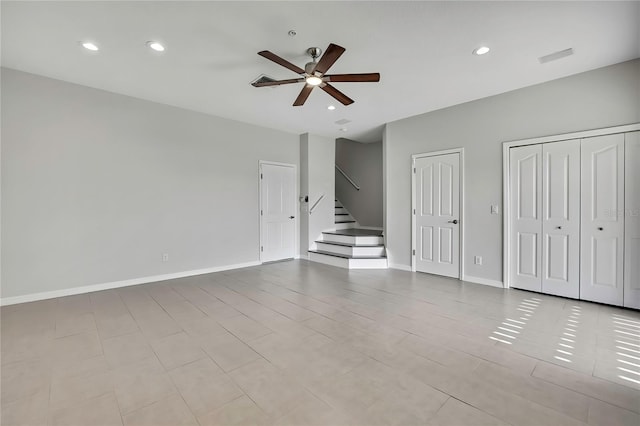 1402 Harbour Walk Rd, Tampa, FL 33602 - unfurnished living room with ceiling fan, stairs, recessed lighting, and baseboards