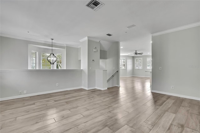 1402 Harbour Walk Rd, Tampa, FL 33602 - unfurnished living room with a chandelier, crown molding, wood finished floors, baseboards, and recessed lighting