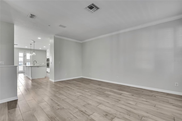 1402 Harbour Walk Rd, Tampa, FL 33602 - unfurnished room featuring light wood-type flooring, a sink, baseboards, crown molding, and recessed lighting