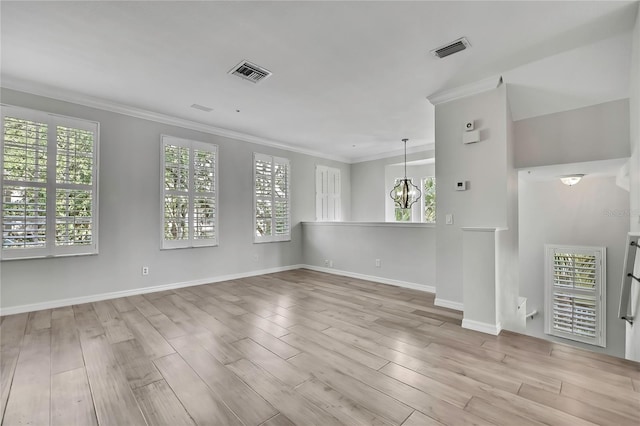 1402 Harbour Walk Rd, Tampa, FL 33602 - unfurnished room featuring healthy amount of natural light, wood finished floors, ornamental molding, baseboards, and a chandelier