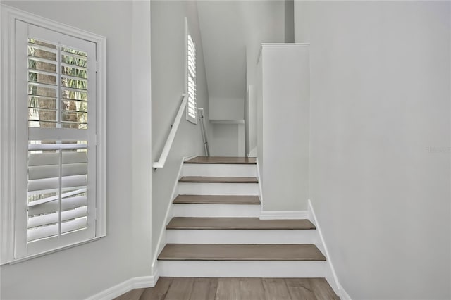 1402 Harbour Walk Rd, Tampa, FL 33602 - staircase featuring baseboards and wood finished floors