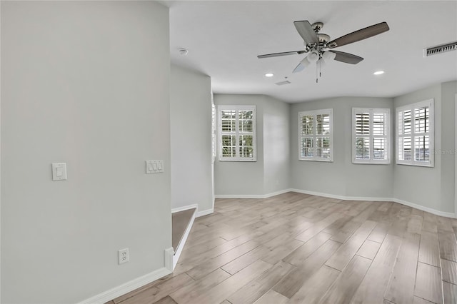 1402 Harbour Walk Rd, Tampa, FL 33602 - spare room with ceiling fan, baseboards, recessed lighting, and wood finished floors