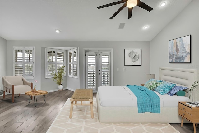 1402 Harbour Walk Rd, Tampa, FL 33602 - bedroom with wood finished floors, recessed lighting, lofted ceiling, baseboards, and access to outside