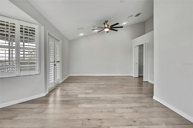1402 Harbour Walk Rd, Tampa, FL 33602 - empty room with ceiling fan, vaulted ceiling, wood finished floors, baseboards, and recessed lighting