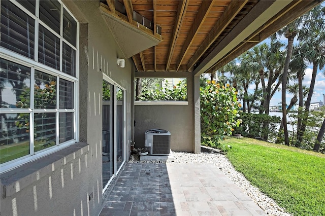 1402 Harbour Walk Rd, Tampa, FL 33602 - view of patio with central air condition unit and a water view