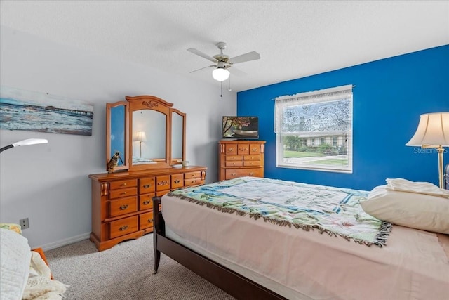 2214 Highclere Cir Unit 6, Sun City Center, FL 33573 - carpeted bedroom featuring baseboards, ceiling fan, and a textured ceiling