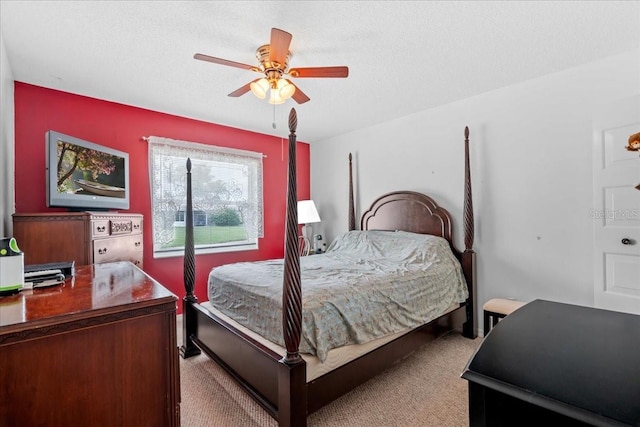2214 Highclere Cir Unit 6, Sun City Center, FL 33573 - bedroom with carpet flooring, ceiling fan, and a textured ceiling