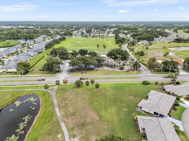 2214 Highclere Cir Unit 6, Sun City Center, FL 33573 - aerial perspective of suburban area featuring a nearby body of water and a local golf course