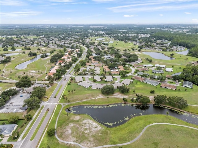 2214 Highclere Cir Unit 6, Sun City Center, FL 33573 - aerial overview of property's location with a large body of water, nearby suburban area, and a golf course