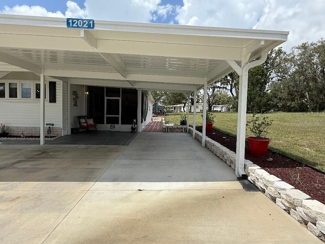 12021 Club House Rd, Brooksville, FL 34613 - view of car parking with an attached carport