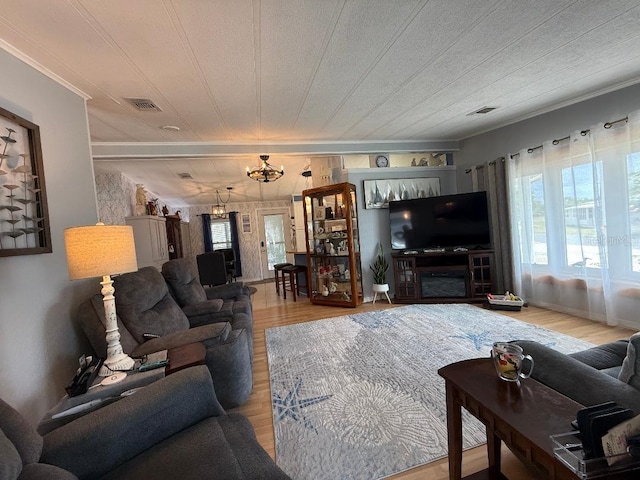 12021 Club House Rd, Brooksville, FL 34613 - living area featuring wood finished floors and crown molding