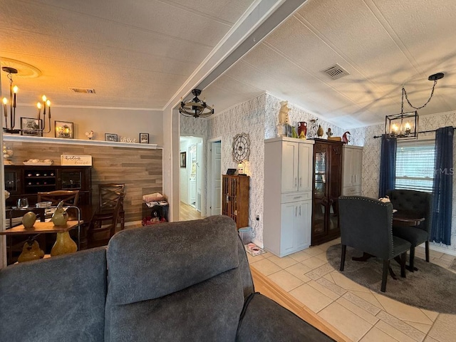 12021 Club House Rd, Brooksville, FL 34613 - living room featuring a chandelier, wallpapered walls, light tile patterned floors, a textured ceiling, and ornamental molding