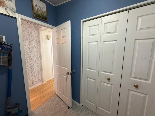 12021 Club House Rd, Brooksville, FL 34613 - hallway with light wood finished floors, baseboards, and ornamental molding