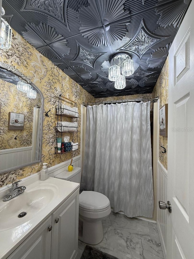 12021 Club House Rd, Brooksville, FL 34613 - bathroom with vanity, toilet, wallpapered walls, marble finish flooring, and a shower with curtain