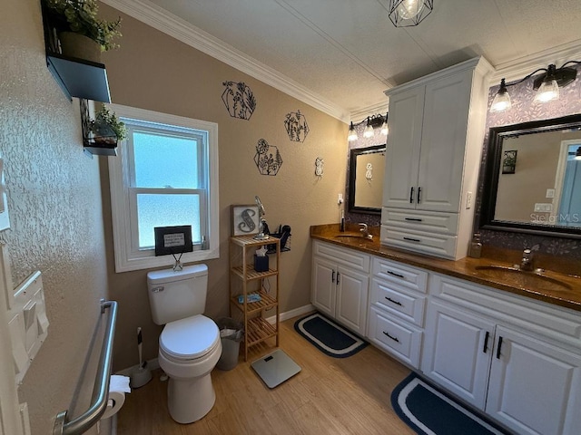 12021 Club House Rd, Brooksville, FL 34613 - bathroom featuring double vanity, ornamental molding, wood finished floors, toilet, and baseboards
