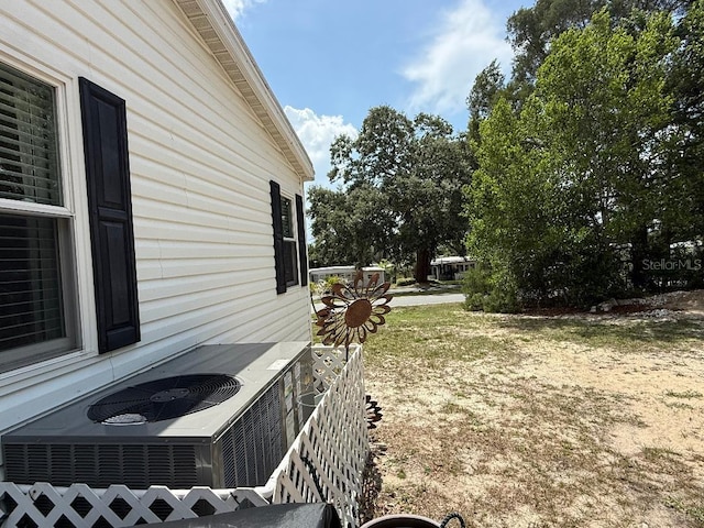 12021 Club House Rd, Brooksville, FL 34613 - view of yard featuring central air condition unit