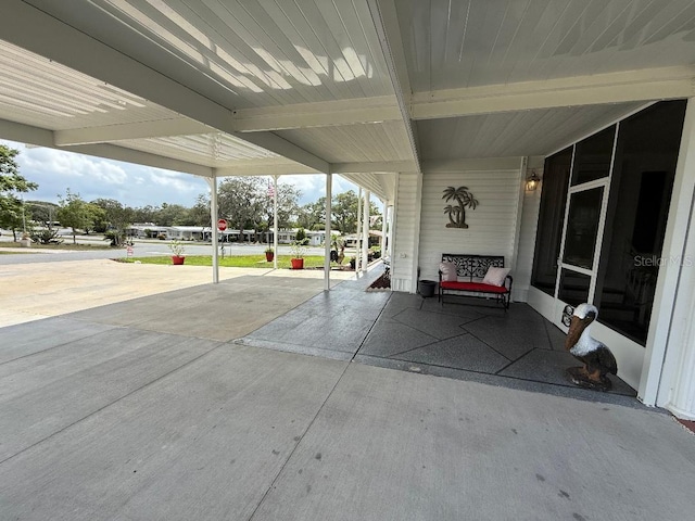 12021 Club House Rd, Brooksville, FL 34613 - view of patio / terrace featuring a carport