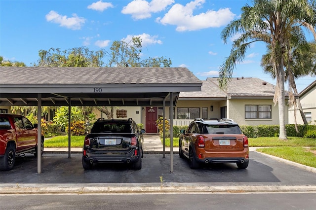 190 Dale Pl, Oldsmar, FL 34677 - view of front of house with covered parking and a shingled roof