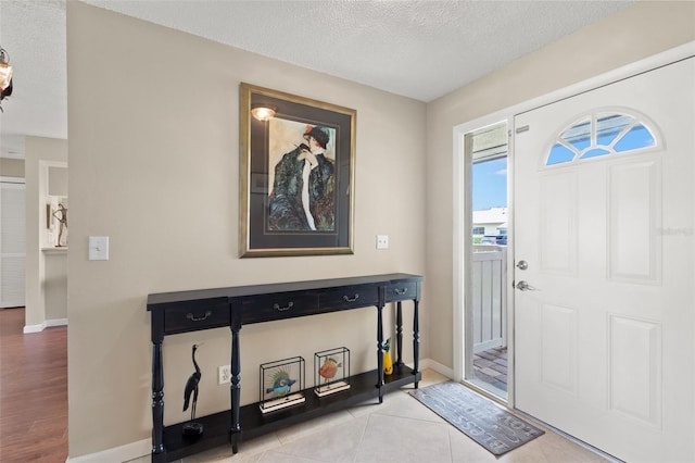 190 Dale Pl, Oldsmar, FL 34677 - foyer entrance featuring a textured ceiling and baseboards