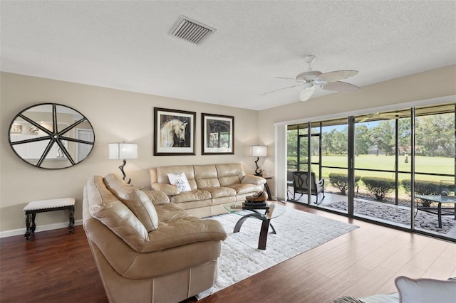 190 Dale Pl, Oldsmar, FL 34677 - living room with dark wood-style floors, ceiling fan, and a textured ceiling
