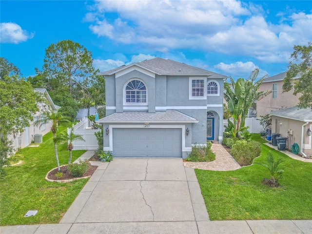 1807 Split Fork Dr, Oldsmar, FL 34677 - traditional home with stucco siding, a garage, driveway, and cooling unit