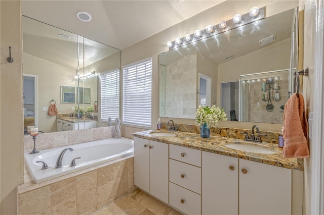 1807 Split Fork Dr, Oldsmar, FL 34677 - full bath with vaulted ceiling, double vanity, a bath, and a stall shower