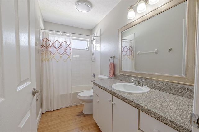 1807 Split Fork Dr, Oldsmar, FL 34677 - bathroom featuring toilet, vanity, shower / bathtub combination with curtain, and wood finished floors