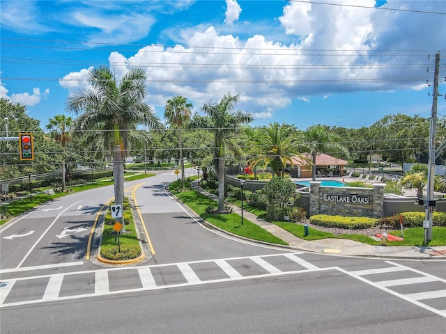 1807 Split Fork Dr, Oldsmar, FL 34677 - view of asphalt road featuring traffic signs, curbs, sidewalks, and traffic lights