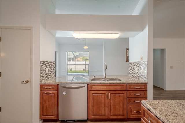 1838 Eagle Ridge Blvd, Palm Harbor, FL 34685 - kitchen featuring stainless steel dishwasher, brown cabinetry, light stone counters, and decorative backsplash