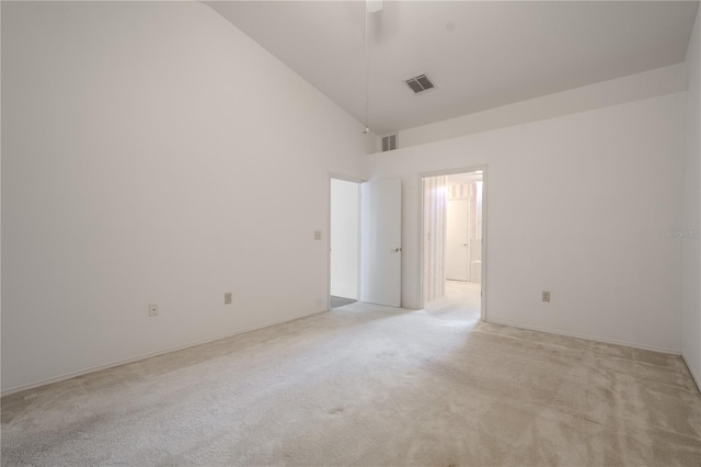 1838 Eagle Ridge Blvd, Palm Harbor, FL 34685 - spare room featuring high vaulted ceiling and light carpet