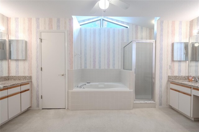 1838 Eagle Ridge Blvd, Palm Harbor, FL 34685 - full bath with wallpapered walls, a bath, two vanities, a stall shower, and a ceiling fan