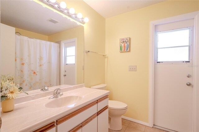 1838 Eagle Ridge Blvd, Palm Harbor, FL 34685 - full bathroom with vanity, tile patterned flooring, and a shower with shower curtain