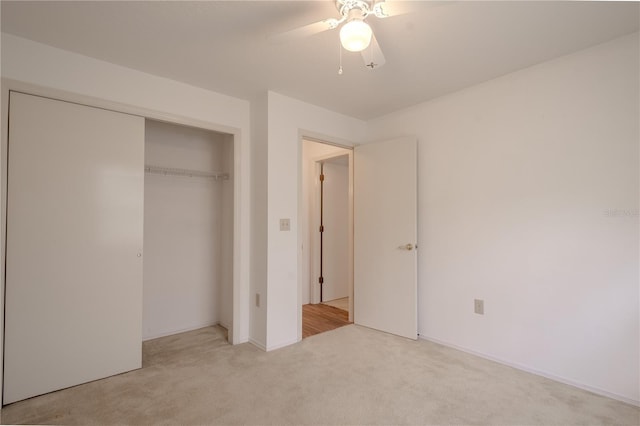 1838 Eagle Ridge Blvd, Palm Harbor, FL 34685 - unfurnished bedroom featuring light colored carpet, a closet, and ceiling fan