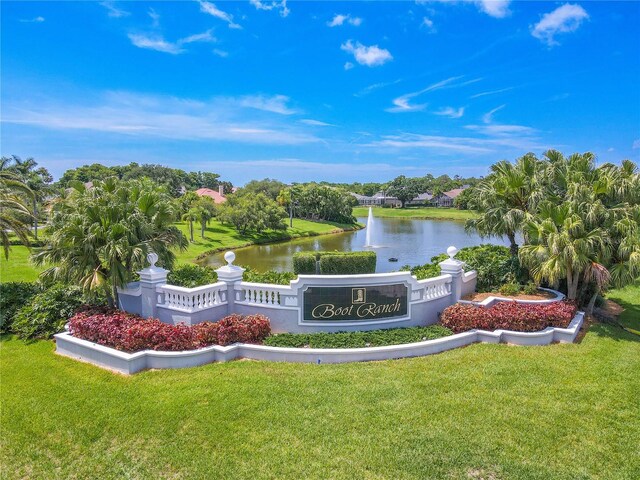 1838 Eagle Ridge Blvd, Palm Harbor, FL 34685 - community / neighborhood sign with a water view and a lawn