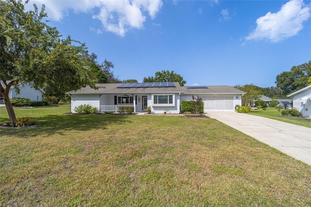 8225 SW 108th Street Rd, Ocala, FL 34481 - single story home with a porch, an attached garage, solar panels, concrete driveway, and a front lawn