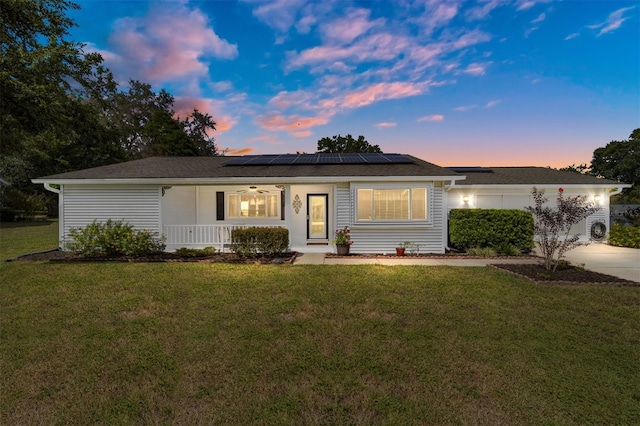 8225 SW 108th Street Rd, Ocala, FL 34481 - single story home featuring a porch, solar panels, and a front yard