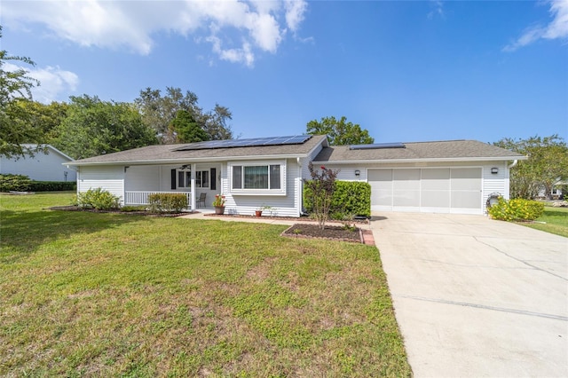 8225 SW 108th Street Rd, Ocala, FL 34481 - ranch-style house with covered porch, an attached garage, solar panels, a front yard, and concrete driveway