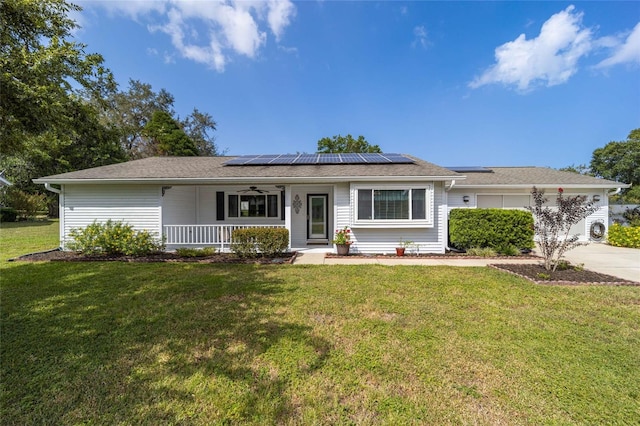 8225 SW 108th Street Rd, Ocala, FL 34481 - ranch-style house with covered porch, solar panels, a front lawn, and ceiling fan