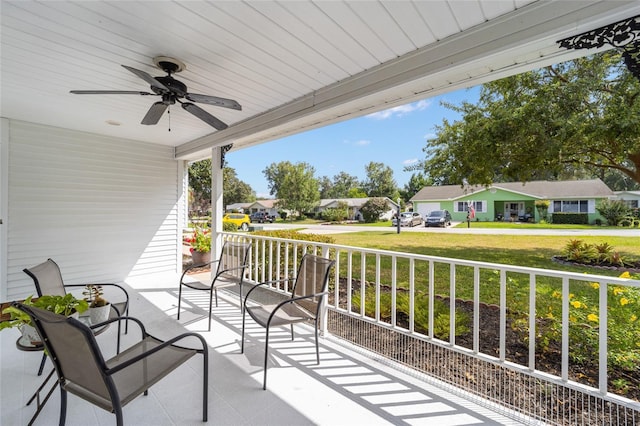 8225 SW 108th Street Rd, Ocala, FL 34481 - covered porch with a residential view and ceiling fan