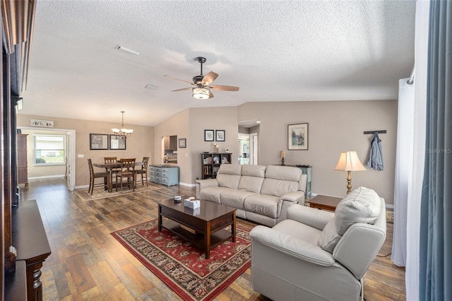 8225 SW 108th Street Rd, Ocala, FL 34481 - living area featuring a ceiling fan, a textured ceiling, wood finished floors, a chandelier, and lofted ceiling