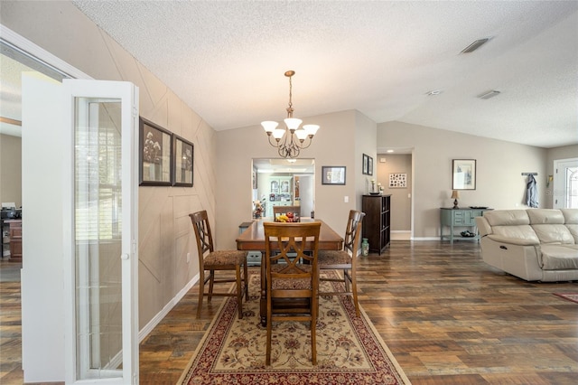 8225 SW 108th Street Rd, Ocala, FL 34481 - dining area featuring dark wood finished floors, a chandelier, lofted ceiling, a textured ceiling, and baseboards