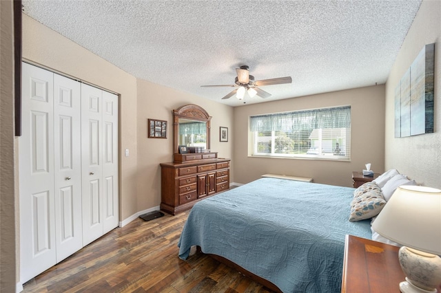8225 SW 108th Street Rd, Ocala, FL 34481 - bedroom with dark wood finished floors, a textured ceiling, a closet, and a ceiling fan