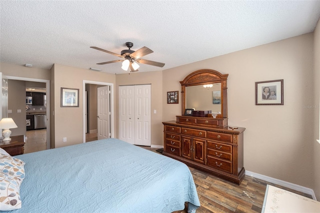 8225 SW 108th Street Rd, Ocala, FL 34481 - bedroom with baseboards, wood finished floors, a ceiling fan, a closet, and a textured ceiling