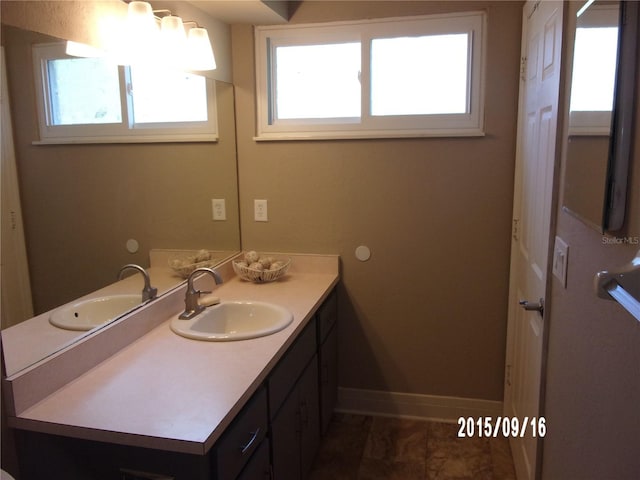 8225 SW 108th Street Rd, Ocala, FL 34481 - bathroom with vanity and baseboards