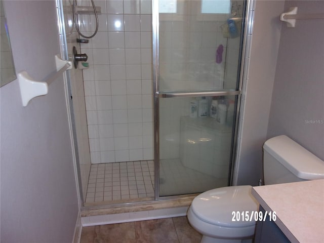 8225 SW 108th Street Rd, Ocala, FL 34481 - bathroom with toilet, vanity, a stall shower, and tile patterned floors
