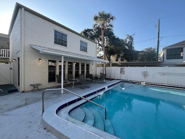 4611 W N B St Unit 125, Tampa, FL 33609 - view of pool featuring a fenced backyard, a patio, and a gate