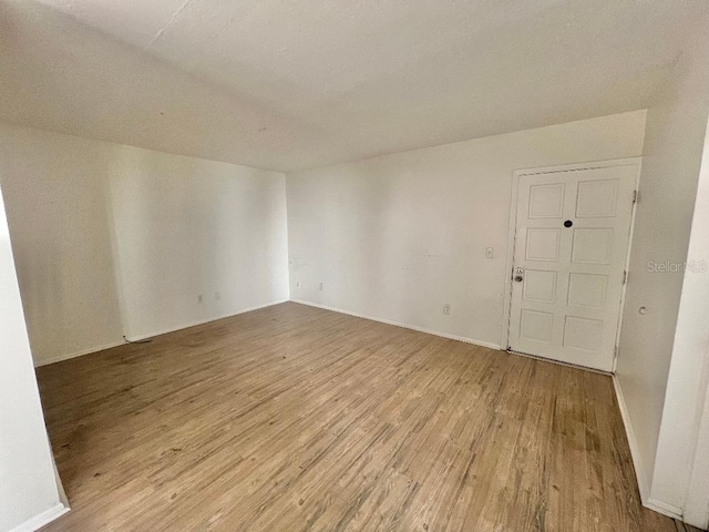 4611 W N B St Unit 125, Tampa, FL 33609 - spare room with wood finished floors and baseboards
