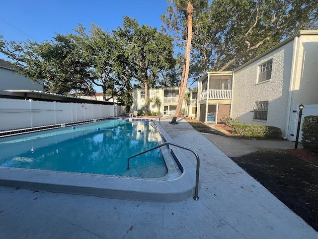 4611 W N B St Unit 125, Tampa, FL 33609 - view of swimming pool featuring a sunroom