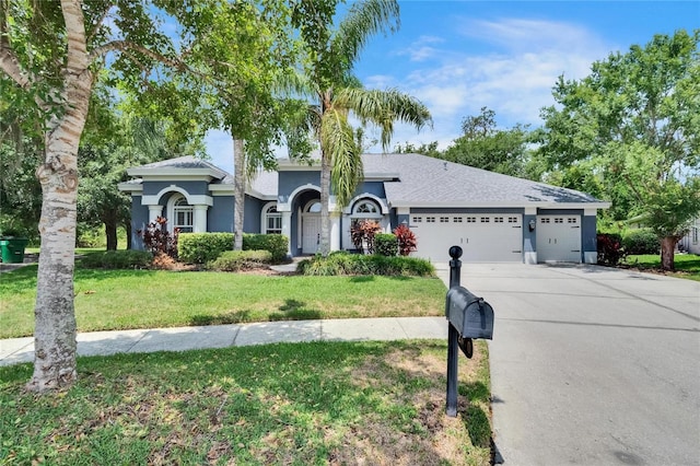 27440 Cedar Park Ct, Wesley Chapel, FL 33544 - view of front of property featuring an attached garage, concrete driveway, a front yard, and stucco siding